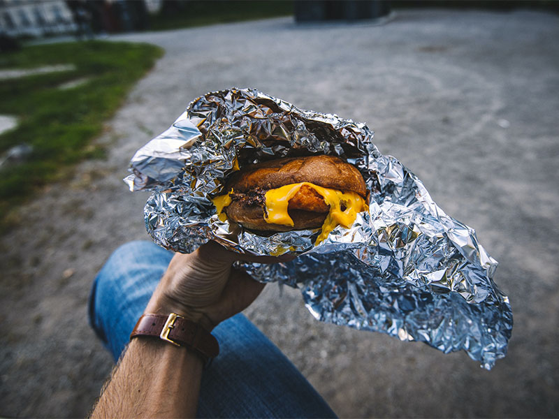 Can You Bring Aluminum Foil Wrapped Food on Planes? 1 A burger wrapped in aluminum tin foil