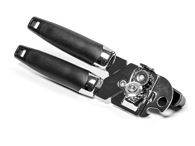 Tin can opener on white background