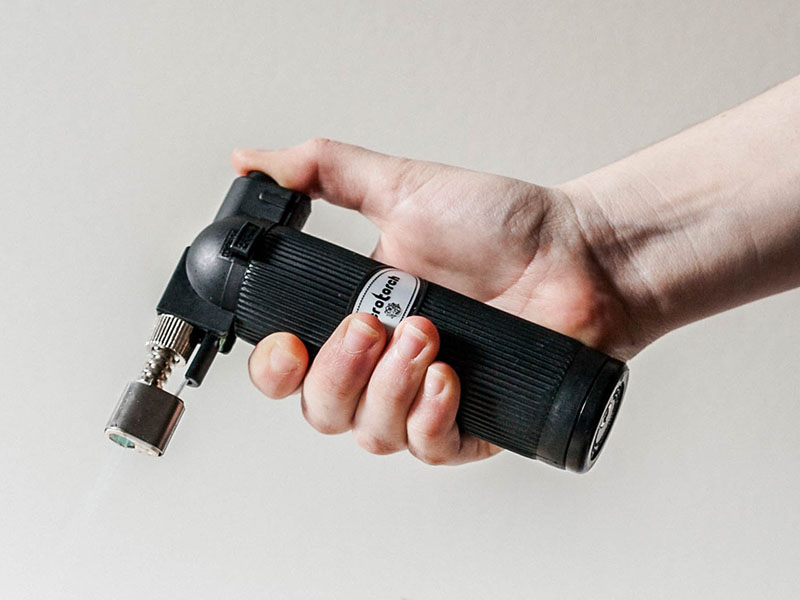 Can You Bring Gas Torches on a Plane? 1 Chef's cooking gas torch held in hand