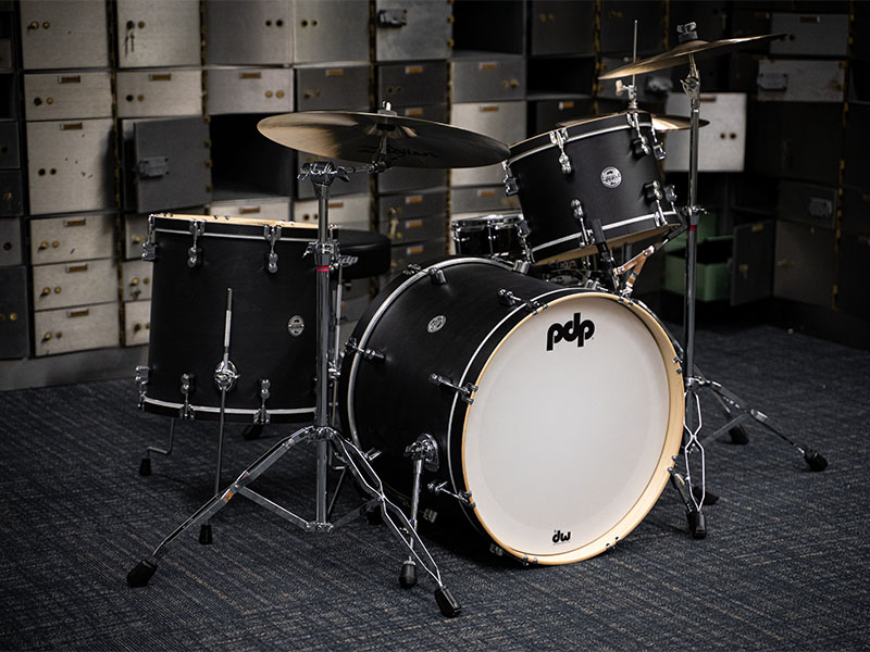 Can You Bring Cymbals, Drumsticks, and Other Drumming Instruments on Planes? 1 A drum set in a dark studio