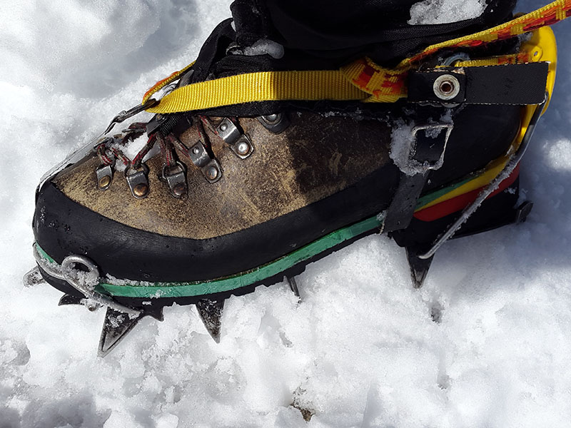 Can You Bring Crampons on Planes? 1 Ice climbing crampons on boots