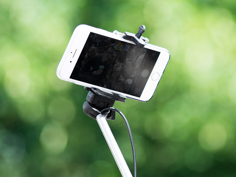 A mobile phone held in a selfie stick