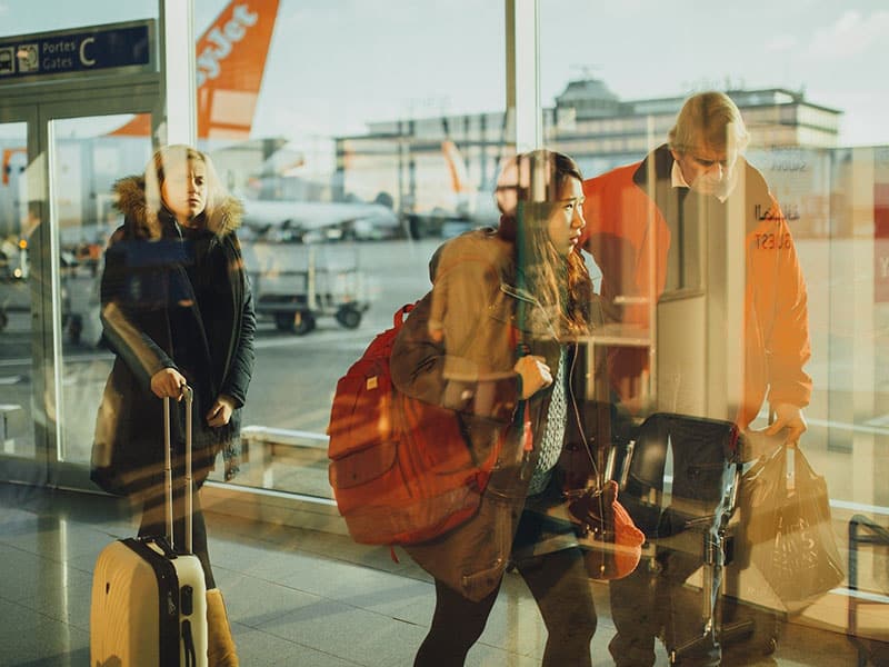 Can Baggage Allowance Be Combined? 1 Multiple people with luggage inside airport