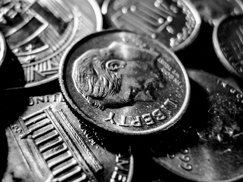 Can You Bring Pennies, Quarters, and Other Coins on Planes? 1 A stack of pennies, quarters, and other coins