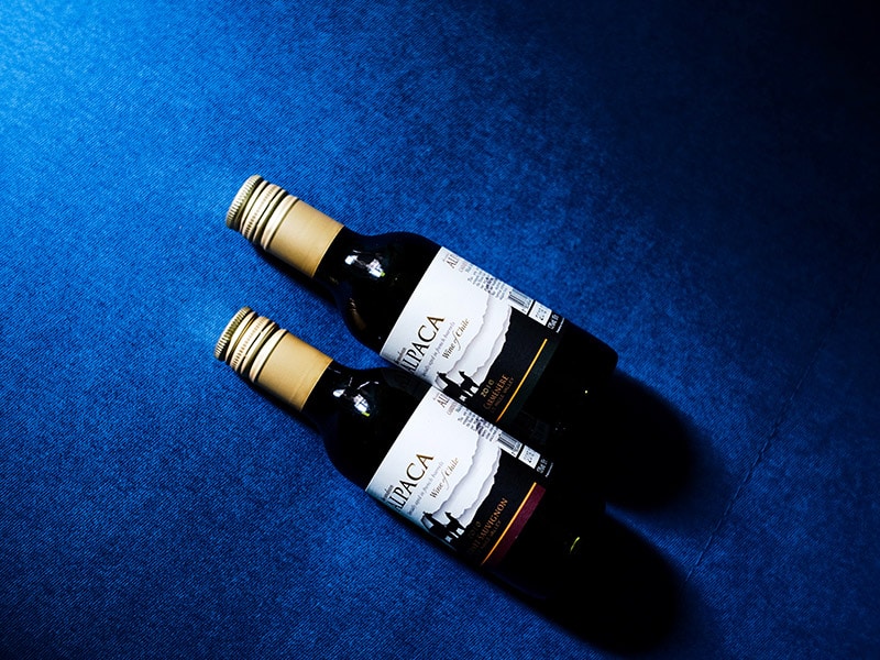 Bringing Nips (Mini Liquor Bottles) on Planes: Here's Everything You Need to Know 1 Two nips (mini alcohol bottles) on a blue background